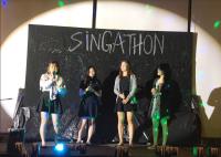 Contestants performing on stage at the Singathon